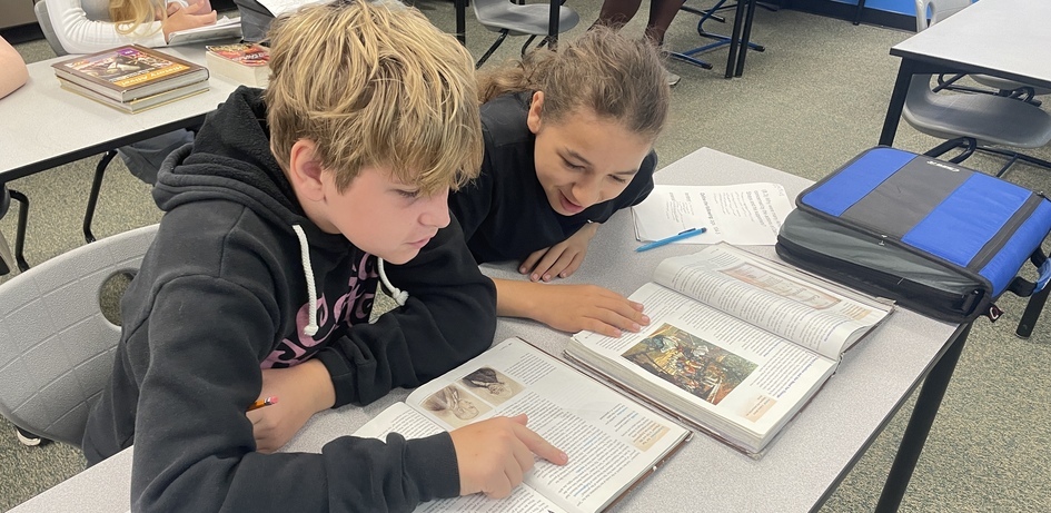 Students Reading Textbook