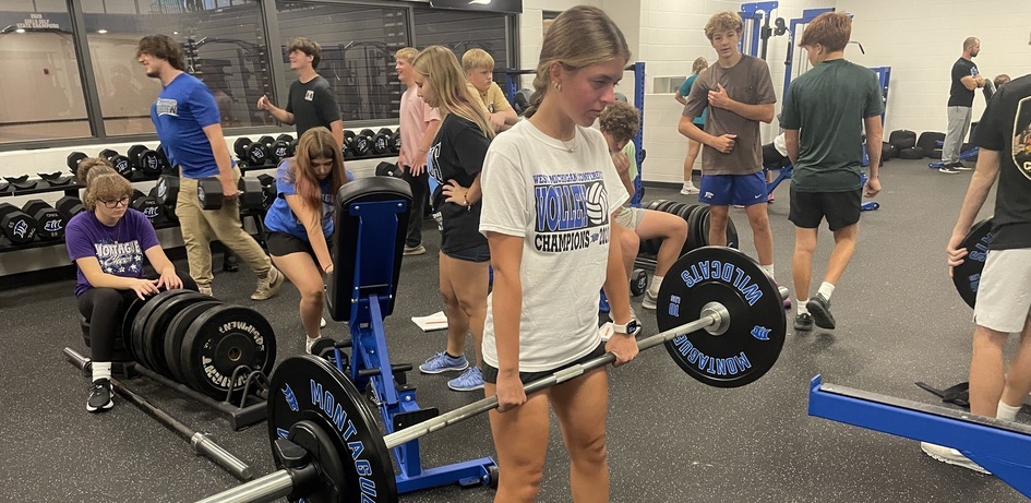 Student Lifting Weights