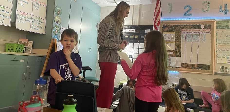 Teacher Helping Student