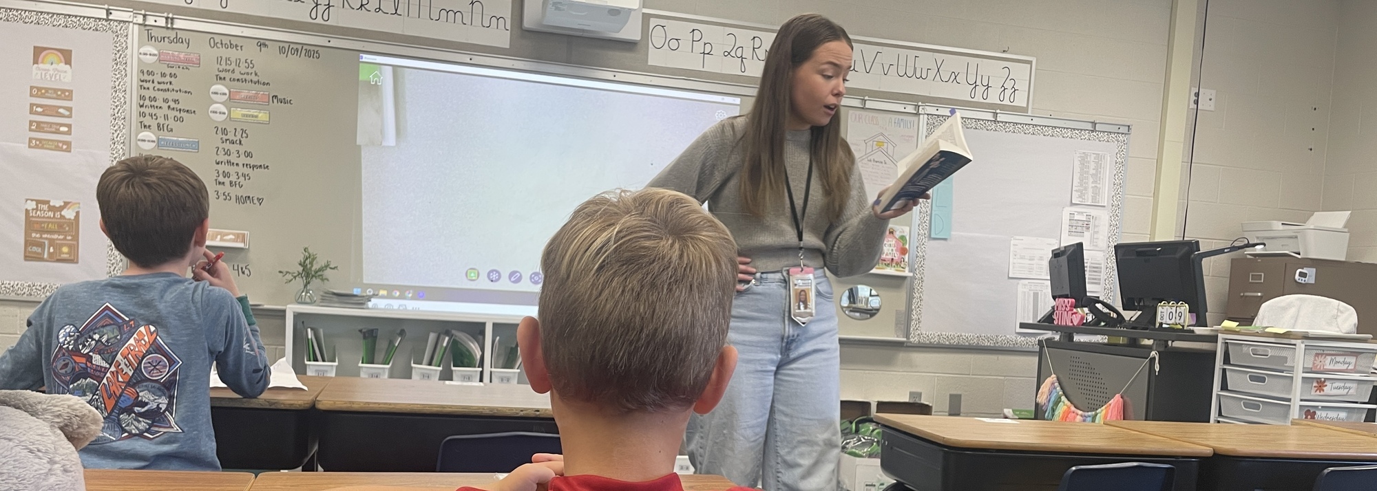 Teacher Reading A Story To Students