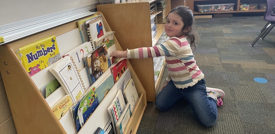 Student Grabbing A Book
