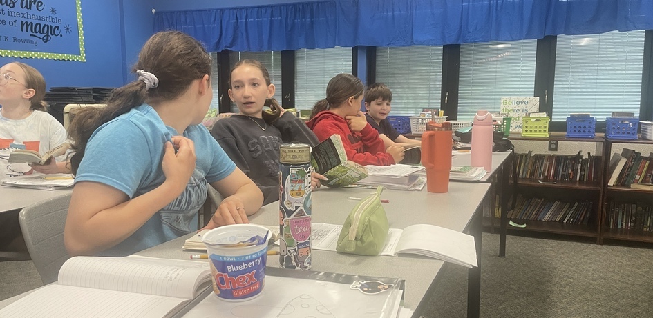 Student Listening To Classmate