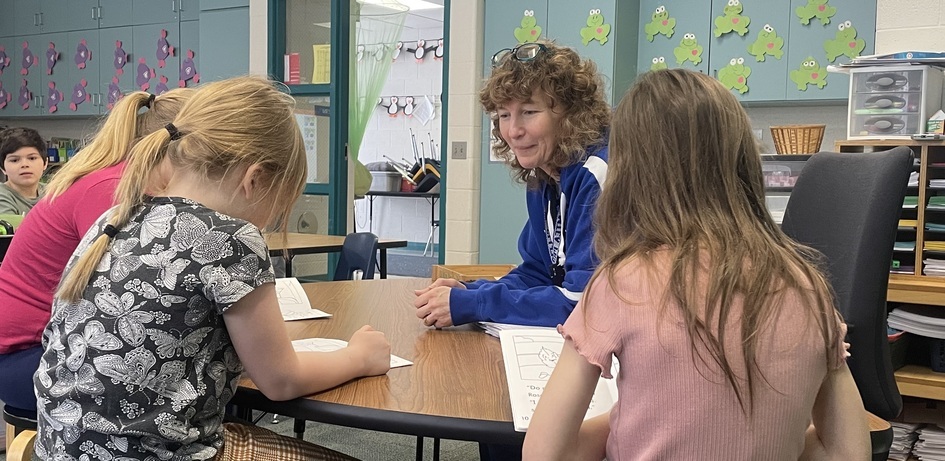 Teacher Helping Small Group
