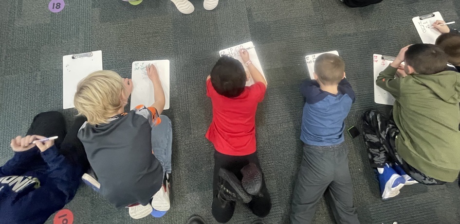 STudents Working on Floor