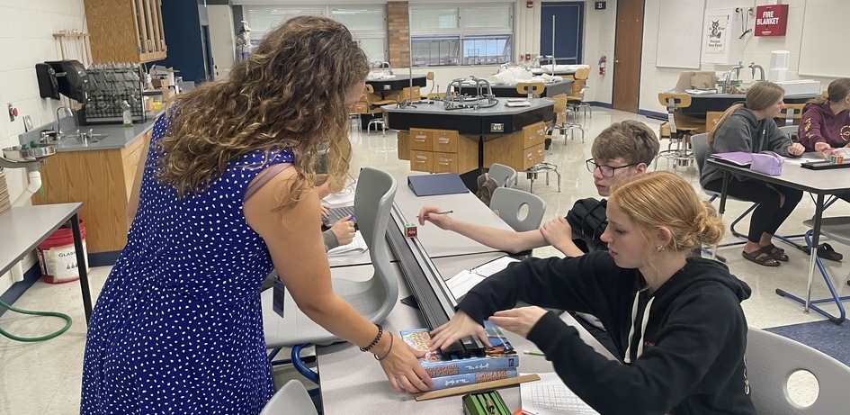 Teacher Assisting Students